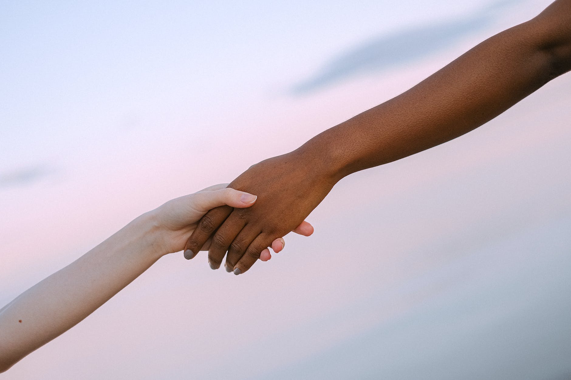 photo of people holding each other s hands