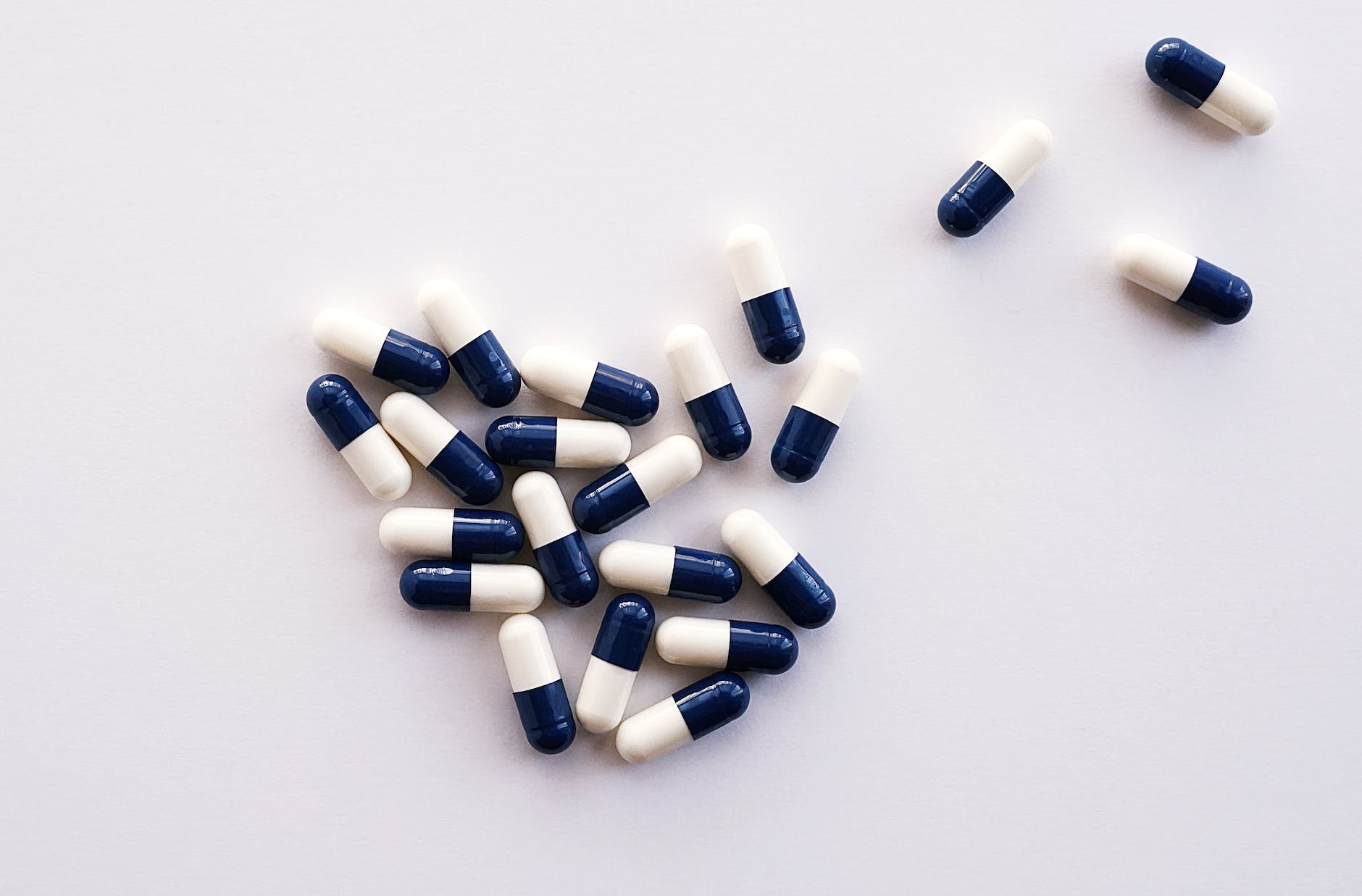 white and blue medication pills